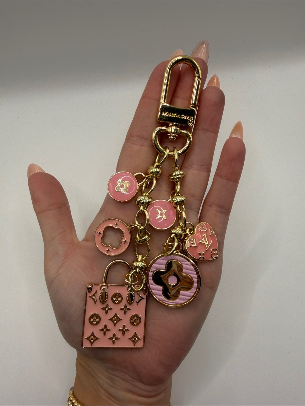 1402. Gold-Tone Pink Charm Keychain or Bag Charm.